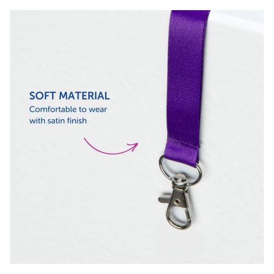 Kuva esittää violettia satiininauhaa metalliklipsillä, korostaen sen pehmeää materiaalia ja mukavuutta käytössä.
