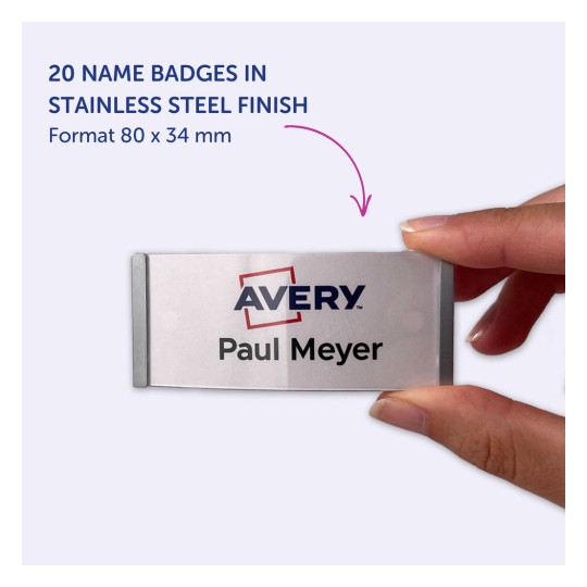Kuva näyttää käden, joka pitää nimikilpeä, jossa on nimi 'Paul Meyer' ja logo 'Avery'. Kilpi on ruostumatonta terästä, mitat ovat 80 x 34 mm, ja tässä muodossa on lueteltu 20 kilpeä.
