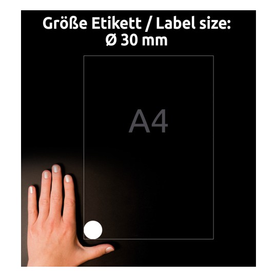 Kuvassa on käsi A4-arkin vieressä, jossa on saksankielinen merkintä tarrakoko nähden 30 mm halkaisijaltaan.