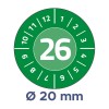 Kuvassa on pyöreä valitsin, joka on merkitty numeroilla 1–12, ja keskellä on näkyvästi esillä numero 26. Valitsimen alapuolella on huomautus, jossa ilmoitetaan halkaisija 20 mm vihreää taustaa vasten.